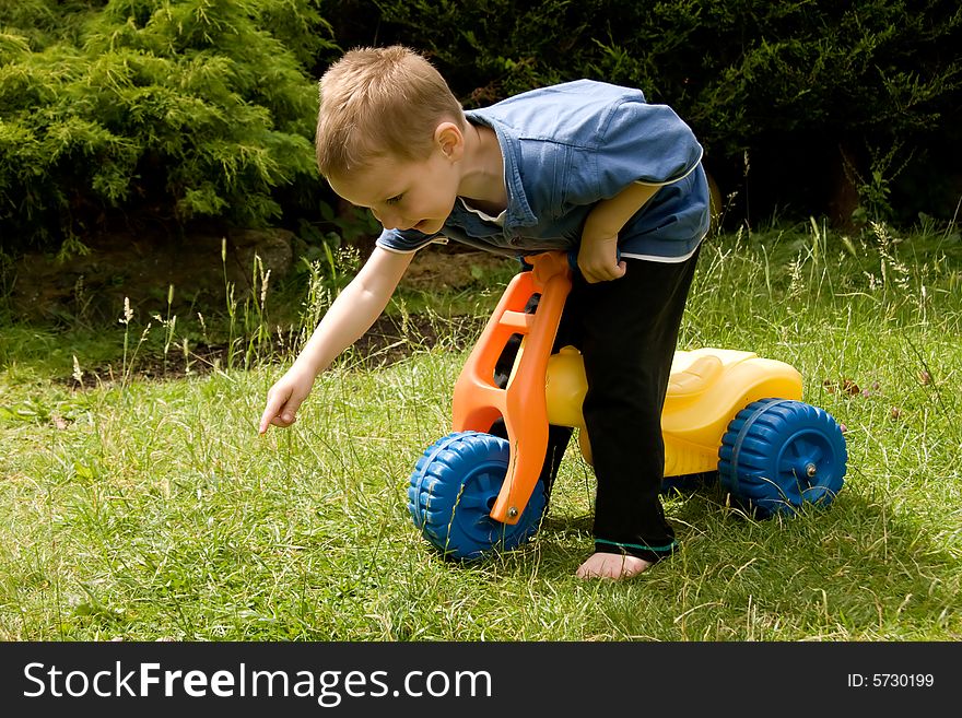 Little boy exploring the garden. Little boy exploring the garden