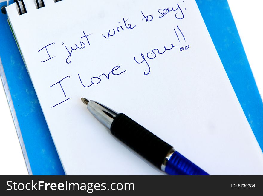 An image of a notebook with love word writen on it. An image of a notebook with love word writen on it