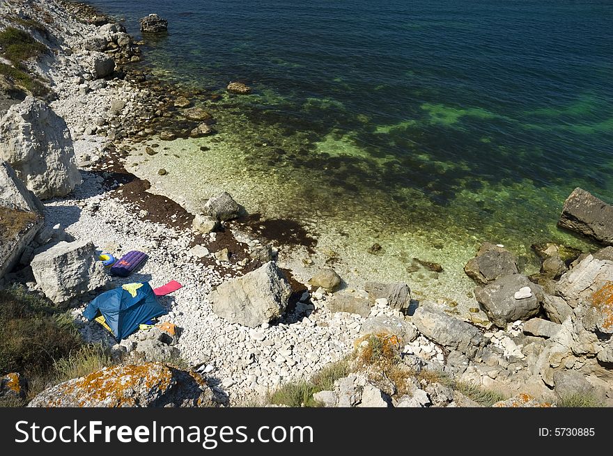 Tents camp on the rocky sea coast. Tents camp on the rocky sea coast