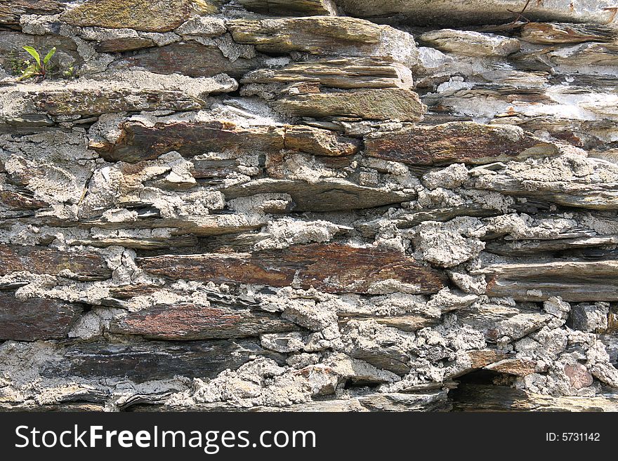 A stone wall built with flat rocks