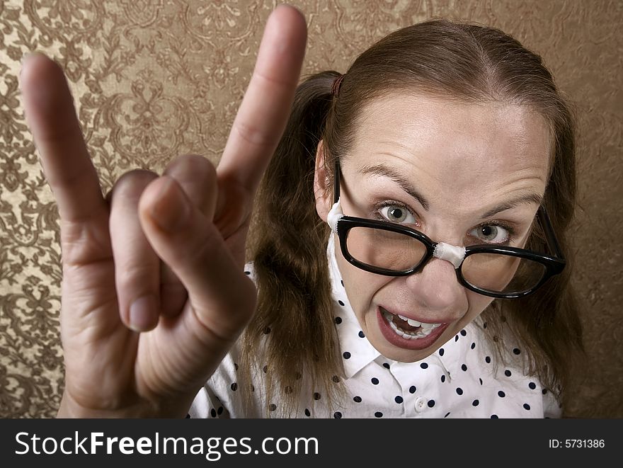 Cute Nerdy Girl Making Bull Horns Gesture