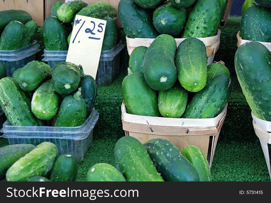 Fresh cucumbers being sold at the farmer's market. Fresh cucumbers being sold at the farmer's market.