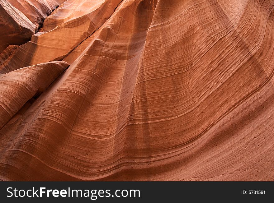 A horizontal detail of a wall inside a slot canyon near Page, Arizona. A horizontal detail of a wall inside a slot canyon near Page, Arizona