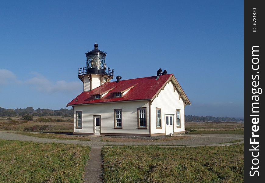 Historic Point Cabrillo Lighthouse set against a blue sky