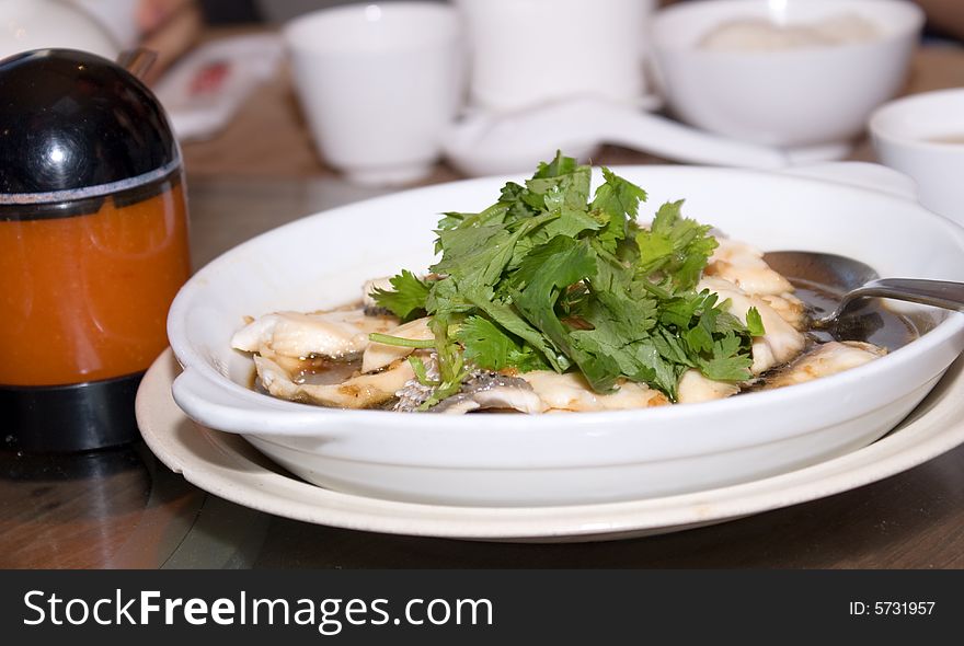 Steamed sliced fish in white plate. Steamed sliced fish in white plate
