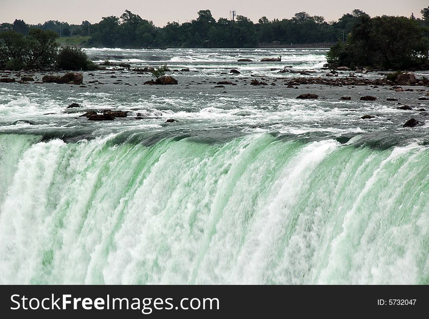 The strong rapids of the Horseshoe Falls. Horseshoe Falls is one of the great Niagara Falls. The strong rapids of the Horseshoe Falls. Horseshoe Falls is one of the great Niagara Falls.