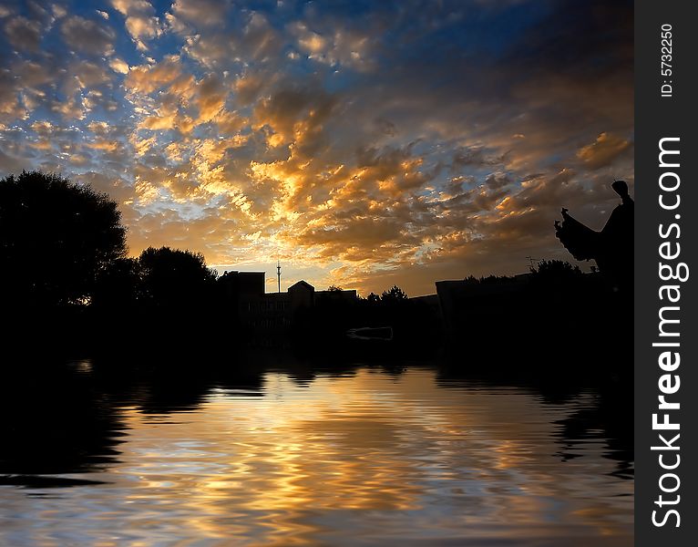 Orange sunrise on reflected water surface. Orange sunrise on reflected water surface