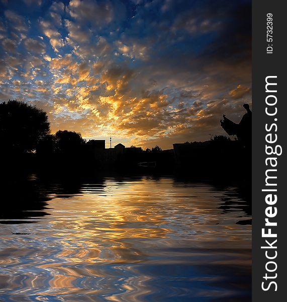 Orange sunrise on reflected water surface. Orange sunrise on reflected water surface