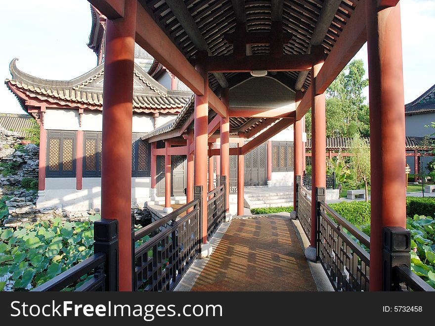 The ancient corridor and summer house in a Chinese garden,Guangdong,South China. The ancient corridor and summer house in a Chinese garden,Guangdong,South China.