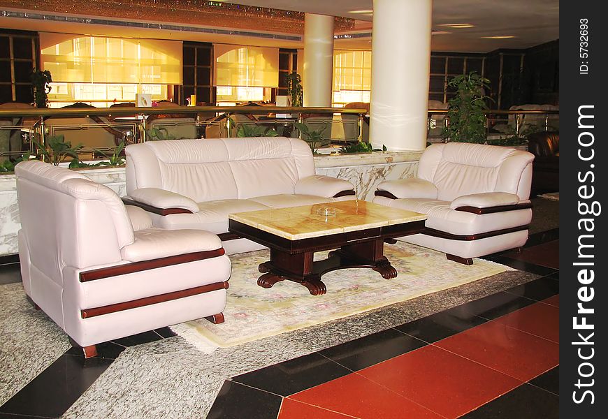 Sofa And Armchairs With Table In Hall Of Hotel