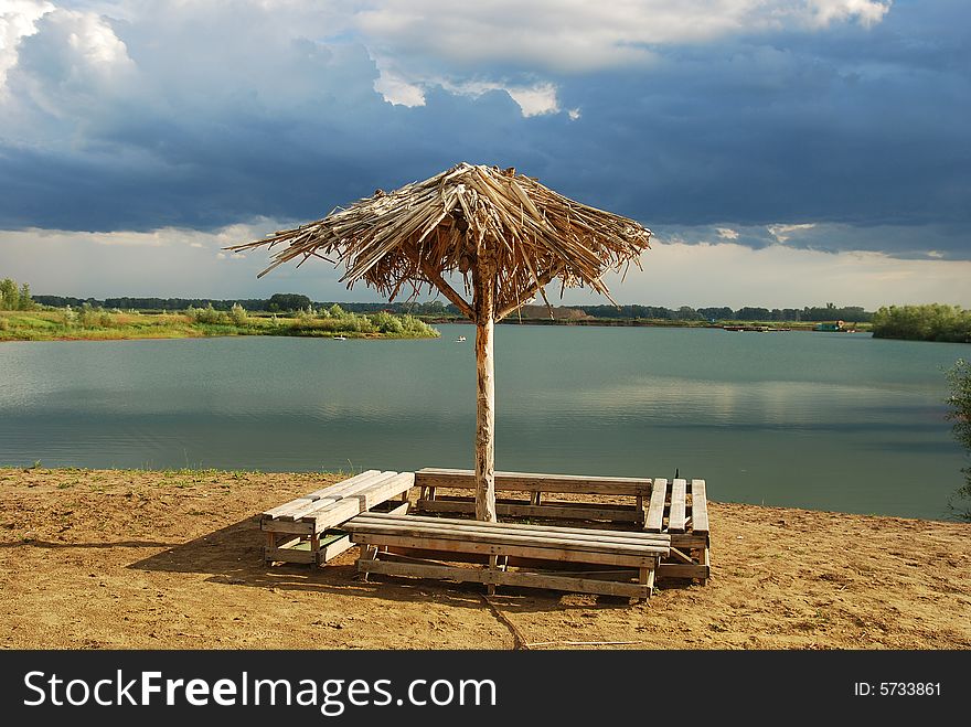 Lonely umbrella on empty beach