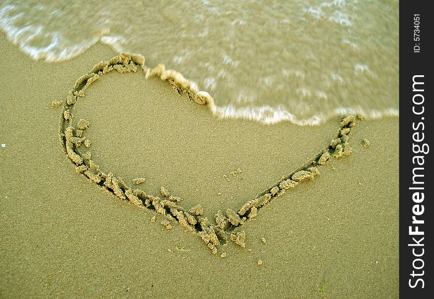 Heart on the beach and water