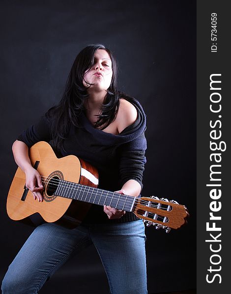 Photo of attractive brunette with guitar. Photo of attractive brunette with guitar