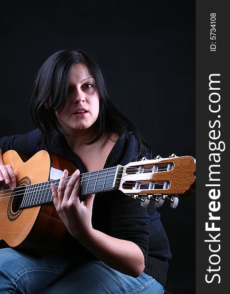 Photo of attractive brunette with guitar. Photo of attractive brunette with guitar