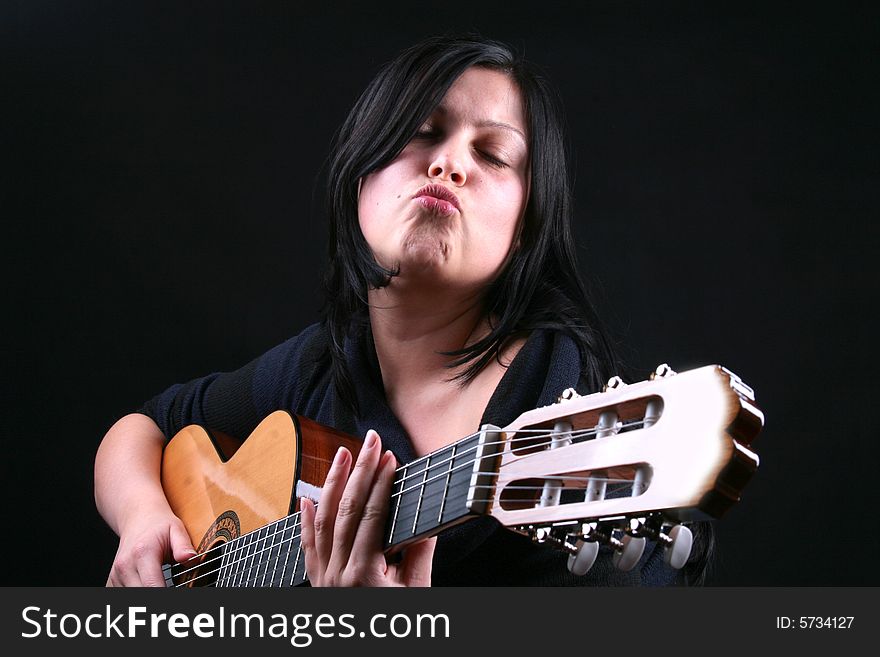 Photo of attractive brunette with guitar. Photo of attractive brunette with guitar