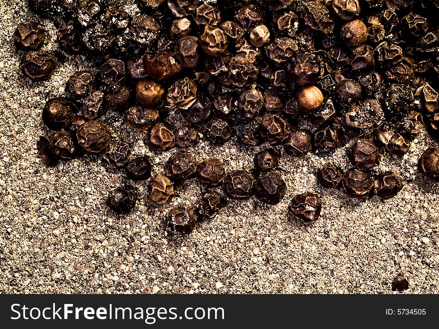 Grains of black pepper on a sacking