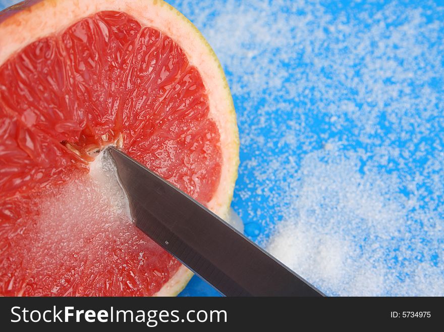 Half Sliced Pomelo on a bright background