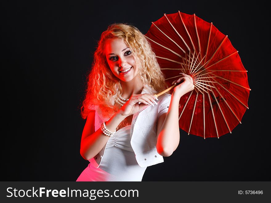 Portrait of young beauty woman in white dress at black background with umbrella. Portrait of young beauty woman in white dress at black background with umbrella