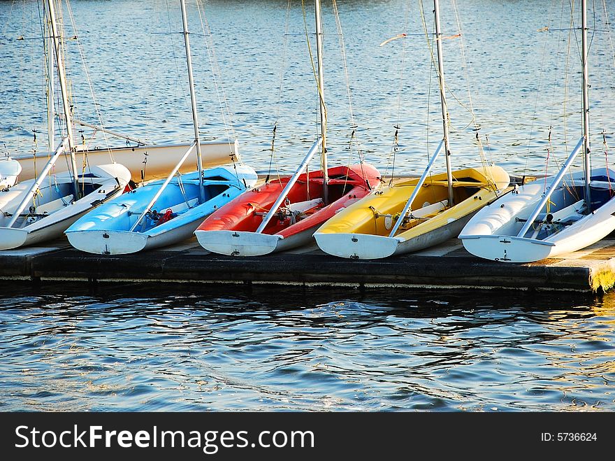 Sailboat trainers moored for the day. Sailboat trainers moored for the day.