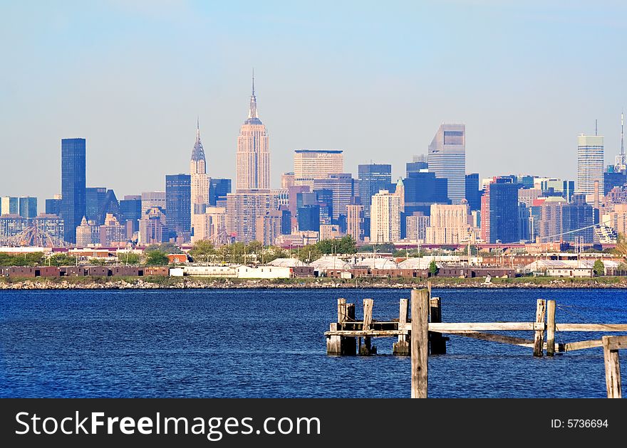 View of Manhattan skyline behind old pilings. View of Manhattan skyline behind old pilings.