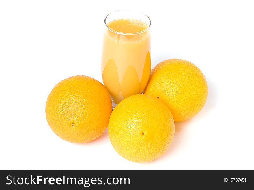 Three oranges and orange juice in the glass isolated on white. Three oranges and orange juice in the glass isolated on white