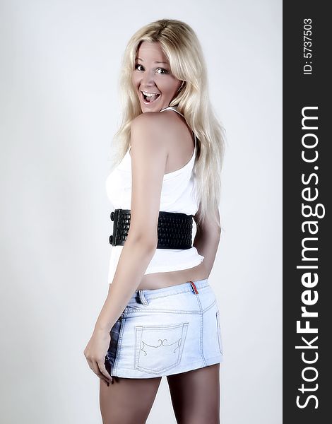 Happy smiling blond girl with skirt on. Happy smiling blond girl with skirt on