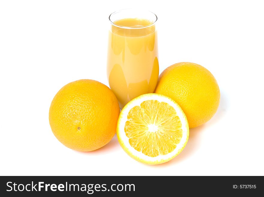 Three oranges and orange juice in the glass isolated on white. Three oranges and orange juice in the glass isolated on white