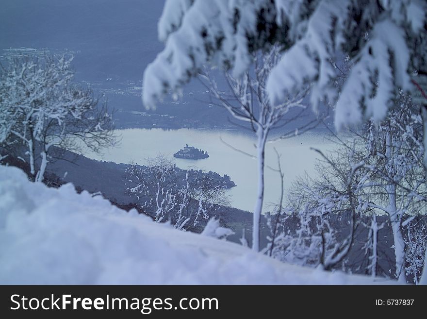 A snowy winter landscapes with lake. A snowy winter landscapes with lake