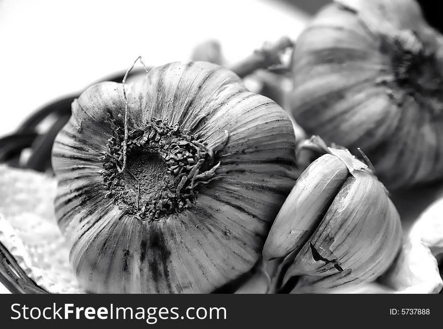 Black and White garlics shots in a kitchen. Black and White garlics shots in a kitchen