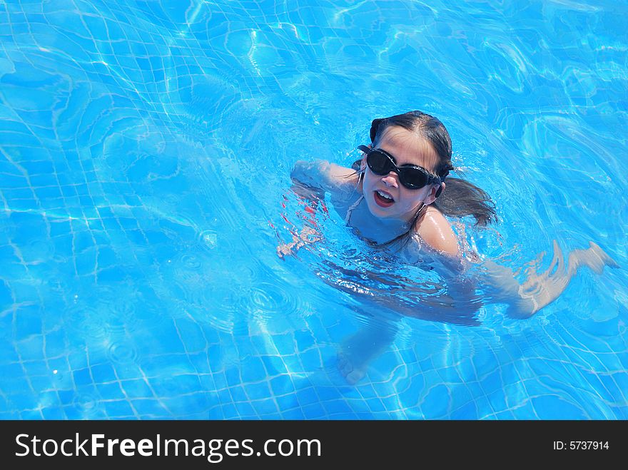 Young girl in swimming pool