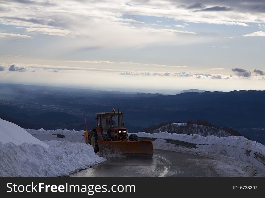 A snowy winter scene with snowplough. A snowy winter scene with snowplough