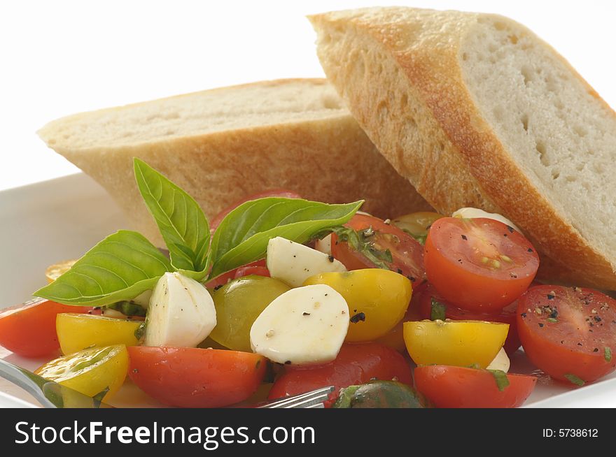 Fresh heirloom toatoes with fresh herbs and bread. Fresh heirloom toatoes with fresh herbs and bread.