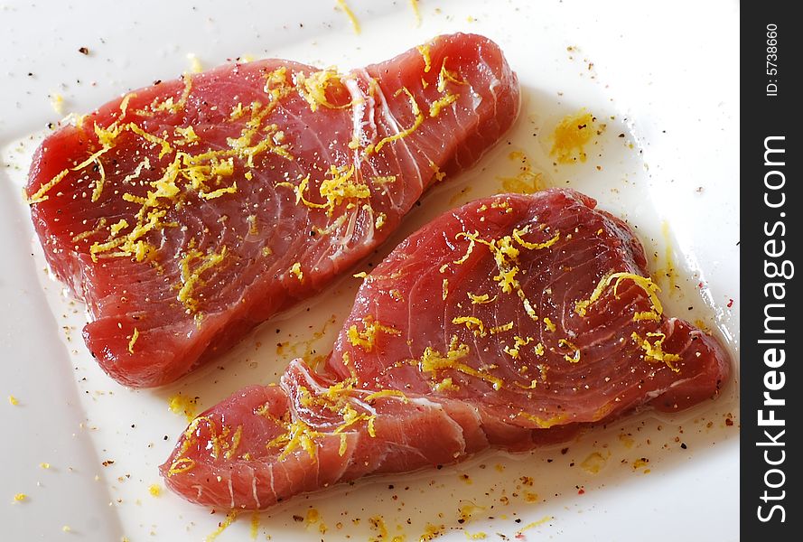 Shot of some raw tuna steaks ready for cooking