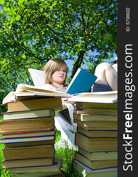 The young attractive student with the books. The young attractive student with the books