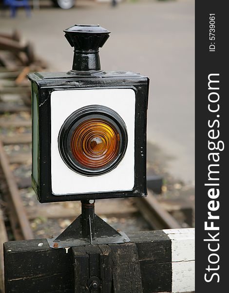 Old railway lantern in the end of a way