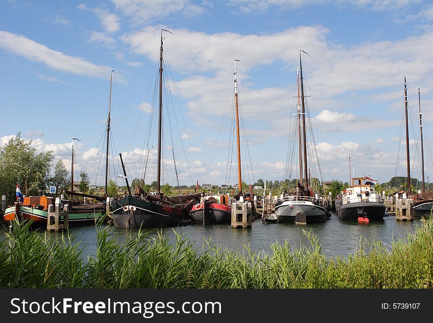 Flatbottom sailboats in the harbor of Holland