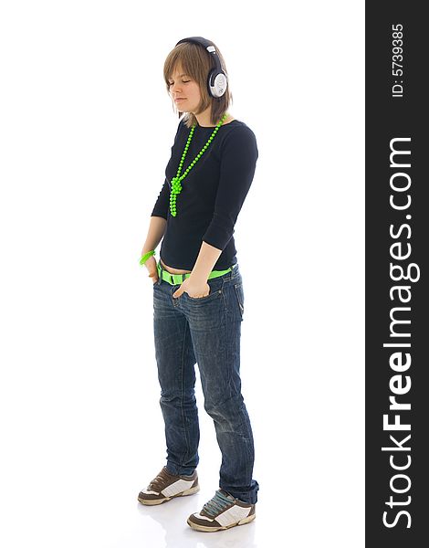 The young girl with a headphones isolated on a white background
