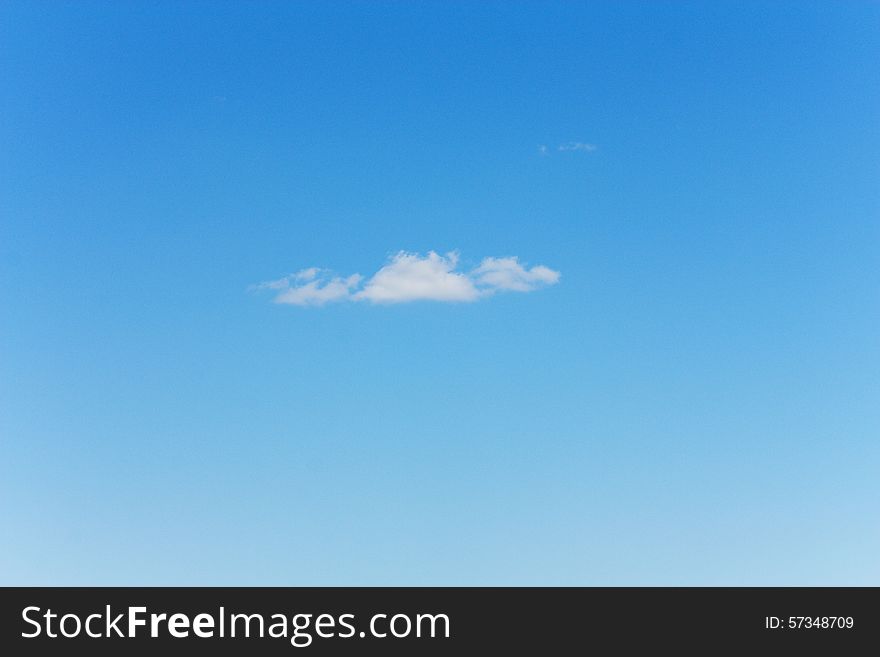 One small cloud in the blue sky