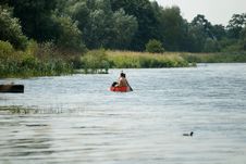 Kayaking At Pond Stock Image