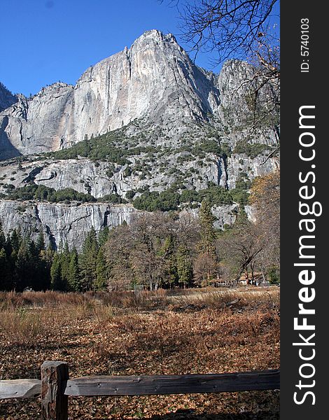 View of a mountain in Yosemite with a fence in the foreground, vertical view. View of a mountain in Yosemite with a fence in the foreground, vertical view