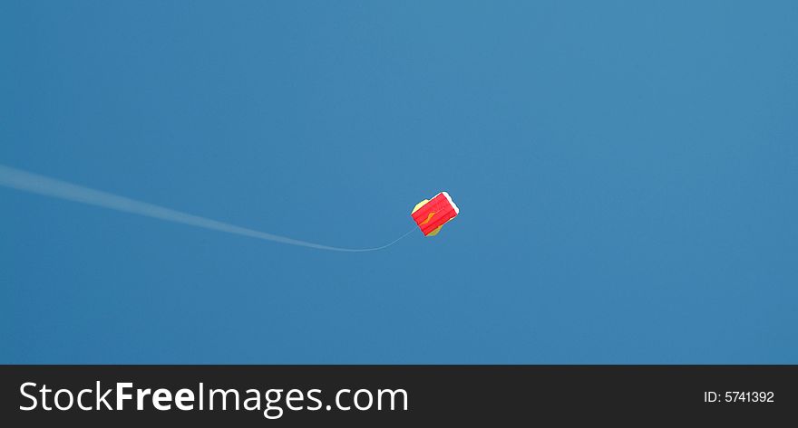 Flying distant kite via string. Flying distant kite via string