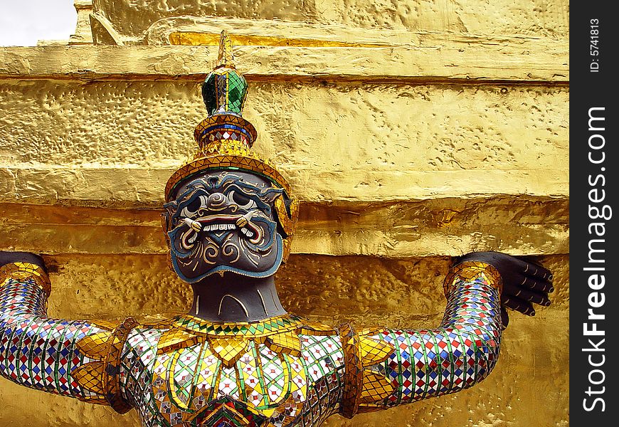 Detailed close-up of a siamese style statue at the Grand Palace and Wat Phra Kaew in Bangkok, Thailand. Detailed close-up of a siamese style statue at the Grand Palace and Wat Phra Kaew in Bangkok, Thailand