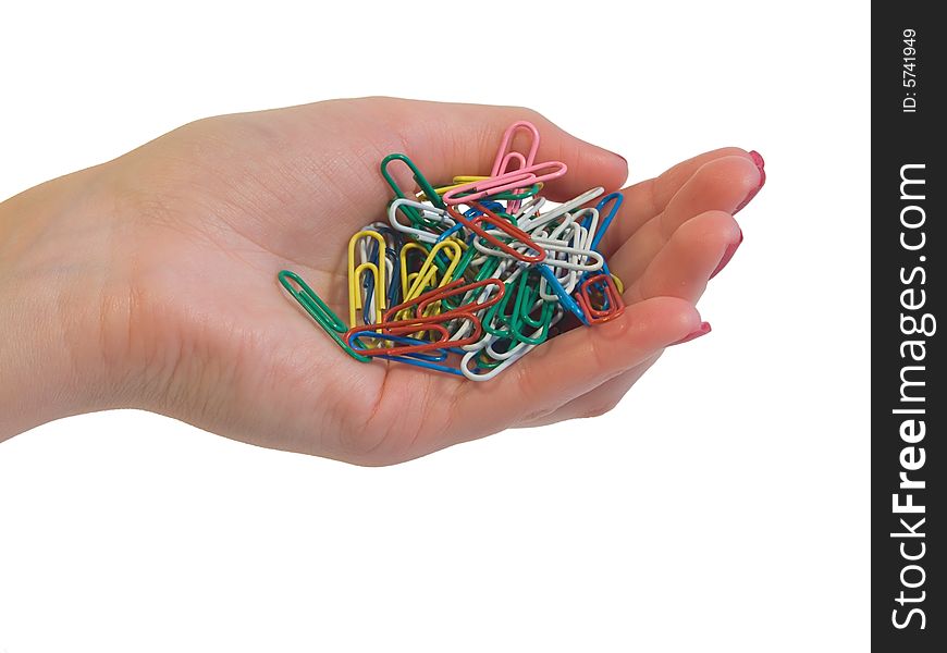 Paper clip in hand isolated on white background