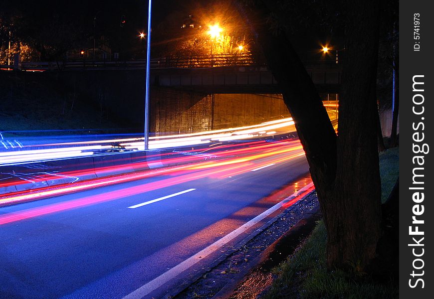 Long exposure picture of a highway at night.