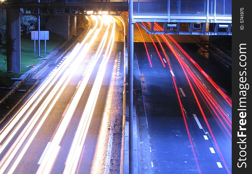 Long exposure picture of a highway at night.