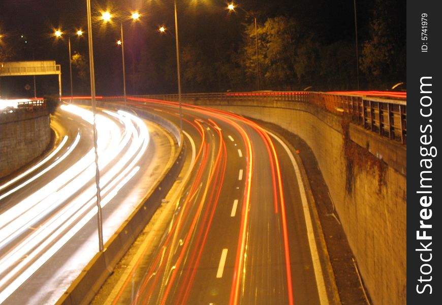 Long exposure picture of a highway at night.