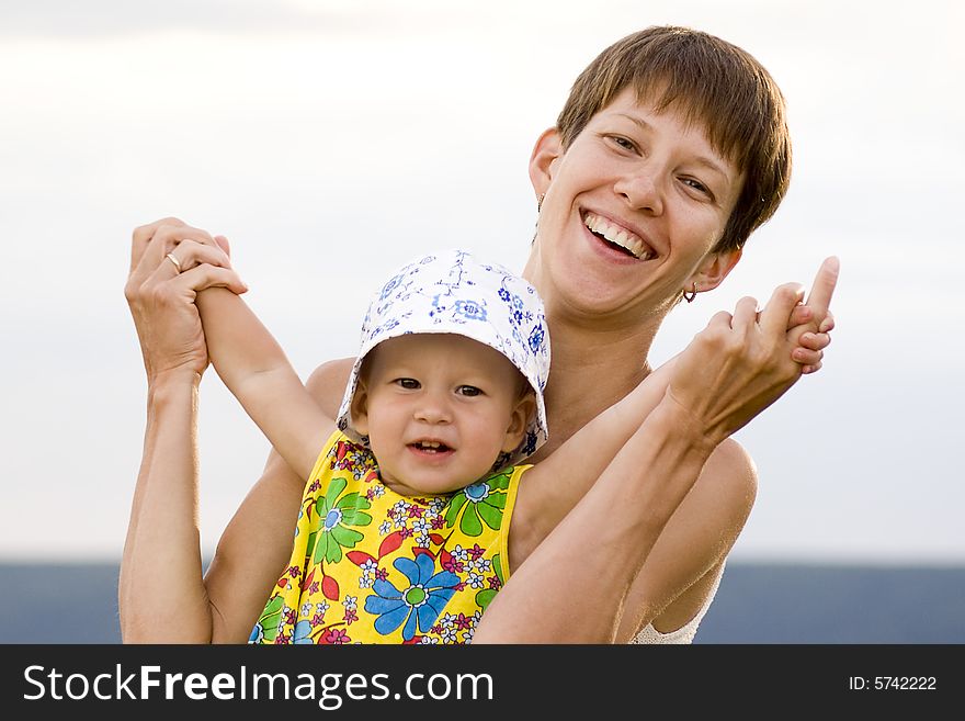 Happy Mother And Daughter Playing Together