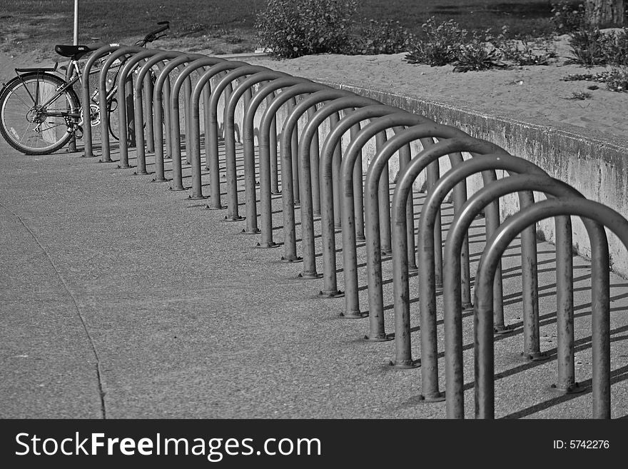 Rusted bike rack in Seattle, WA with one bike