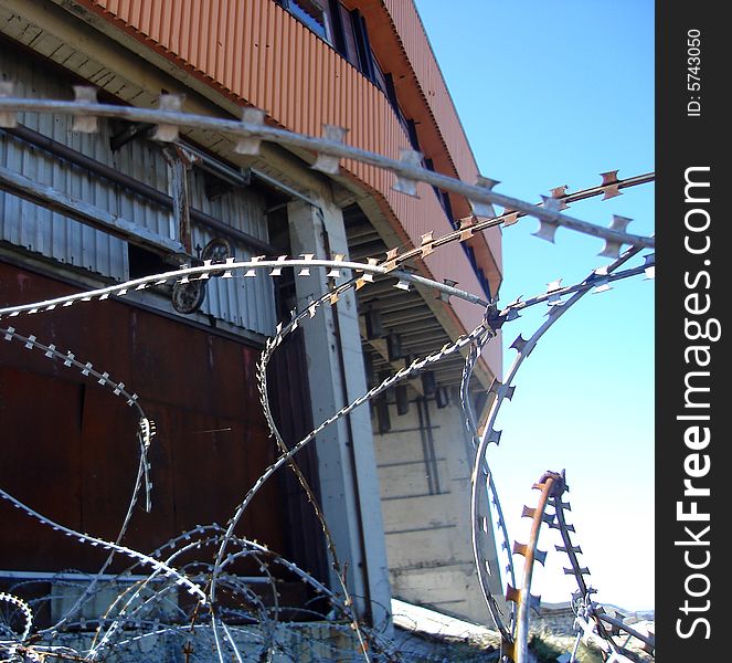 View on Bjelasnica downhill start house through barbed wire remains from Bosnian war 1992-1995, Bosnia and Herzegovina