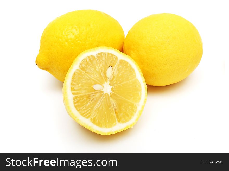 Closeup of an half lemon and others on white background. Closeup of an half lemon and others on white background.
